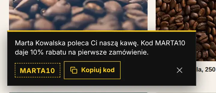 Baner w stylu B: czarny z żółtym kodem MARTA10 i przyciskiem Kopiuj kod.